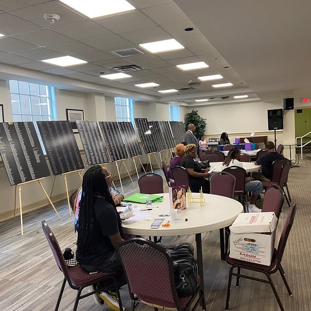 One of our memorial services for victims of crime with the names of victims on boards a…