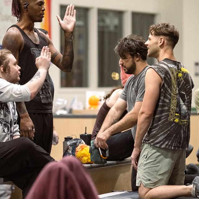 Hand jam tutorial by the squad? Or secret handshake practice?