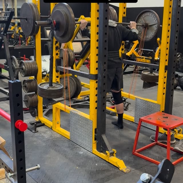 Banded Weight Releaser Pin Squats.

Set up pins at 90 degrees.

Use a controlled eccent…