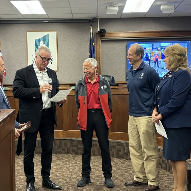 Chuck Whitely, the YMCA’s volunteer Pear Blossom Run Race Director, received a Communit…