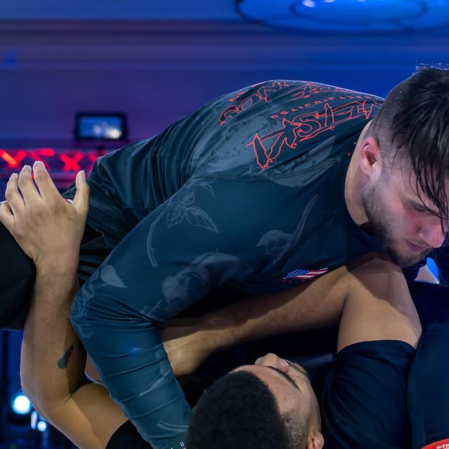 Mike Krevetski executed a clean series of sweeping, passing from chest to chest half gu…