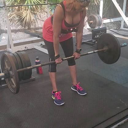 Wife working out under the palm trees. Come check us out for a unique and fun workout. …