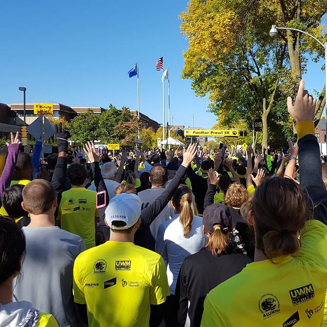 Runners waiting for the start of the #uwm #pantherprowl