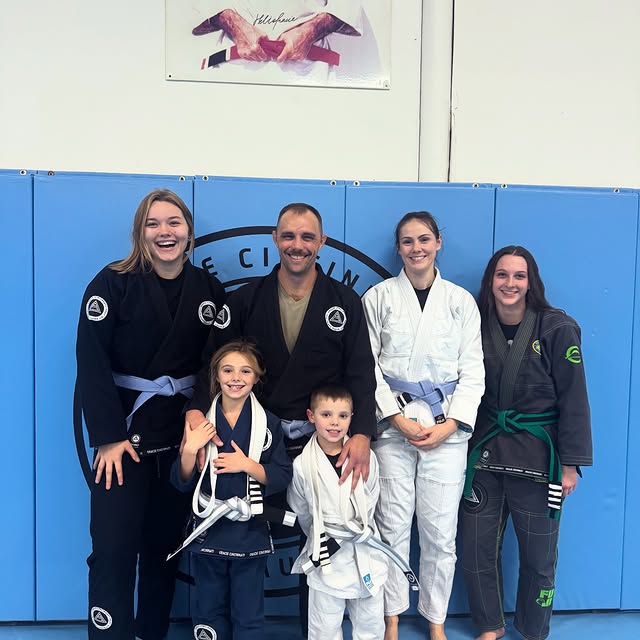 Brother and sister Level Up to their next belt in our Cubs program (ages 5-9) and pose …