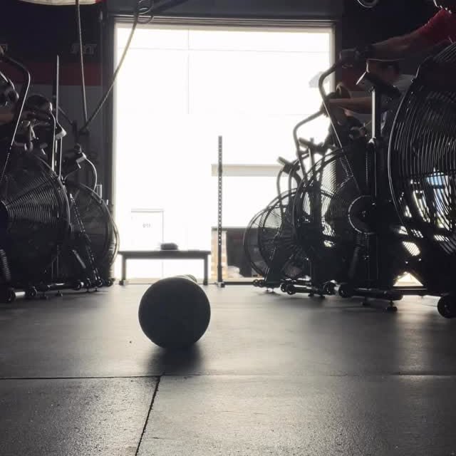 Head to head assault bike battles with one goal: move the foam roller past the center l…